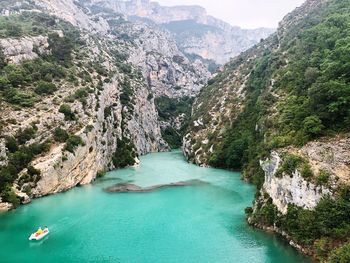 High angle view of lake amidst mountains