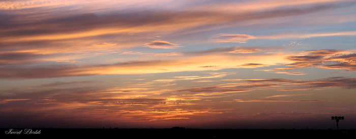 Silhouette of landscape against dramatic sky