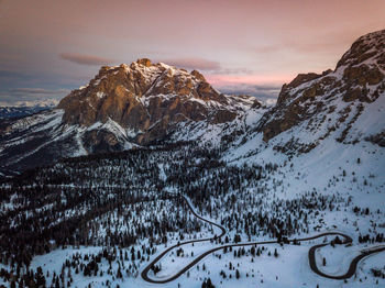 Scenic view of snowcapped mountains against sky during sunset