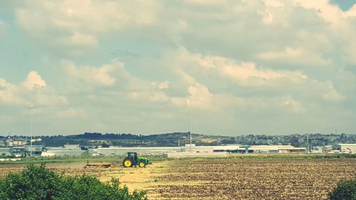 Scenic view of agricultural field against sky