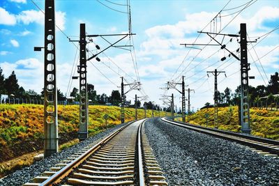 Surface level of railroad tracks against sky
