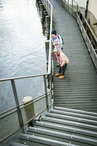 High angle view of man walking on pier