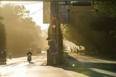 Rear view of man walking on road