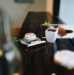 Close-up of coffee cup on table