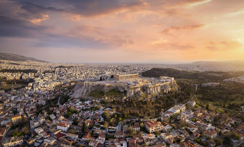 Aerial view of townscape against sky during sunset