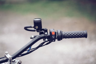 Close-up of coin-operated binoculars against sky