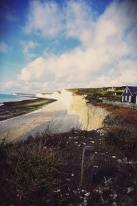 Scenic view of sea against cloudy sky