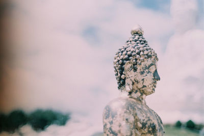 Close-up of statue against sky