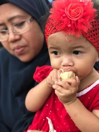 Close-up portrait of cute boy eating