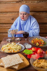 Portrait of man preparing food on table