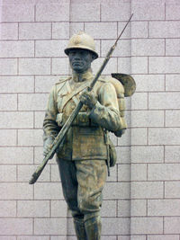 Statue in front of wall