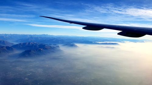 Aerial view of landscape and mountains against sky