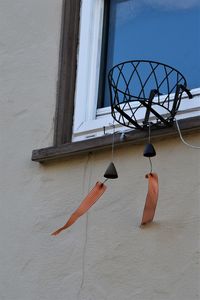 Low angle view of basketball hoop against wall