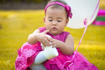 Cute girl playing on field