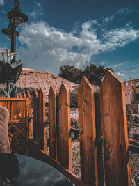Panoramic view of wooden post against sky