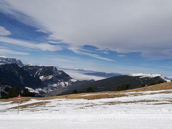 Scenic view of mountains against sky during winter