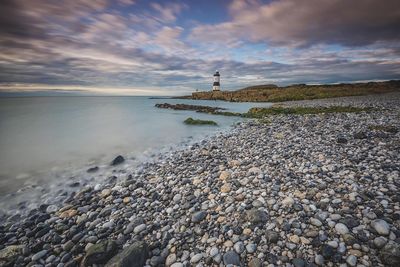 Scenic view of sea against cloudy sky