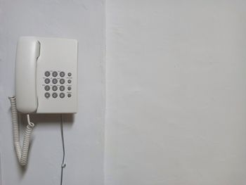 Close-up of telephone on wall