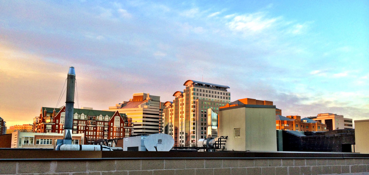 LOW ANGLE VIEW OF MODERN BUILDINGS AGAINST SKY