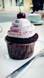 Close-up of cupcake served on table