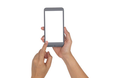 Midsection of person using mobile phone against white background