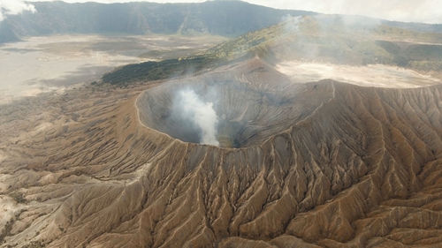 Crater with active volcano smoke in east jawa, indonesia.  volcano crater mount gunung bromo 