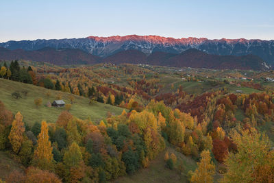 Scenic view of landscape against sky during autumn