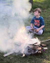 Rear view of boy on shore