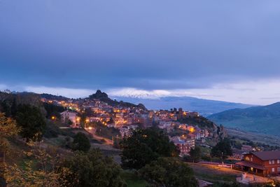 High angle view of illuminated buildings in city against sky