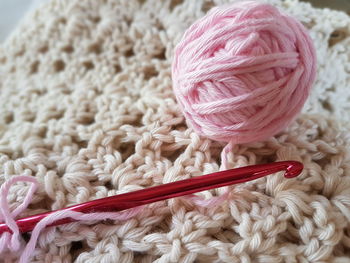 Ball of wool with knitting needle on crochet