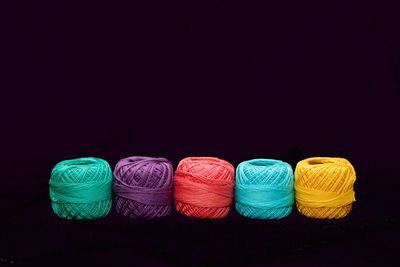 Close-up of colorful objects over black background