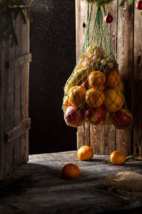 View of fruits hanging from wood
