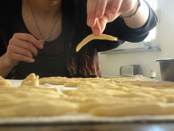 Midsection of woman preparing food