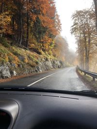 Road seen through car windshield