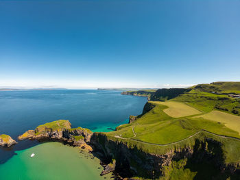 Scenic view of sea against clear blue sky