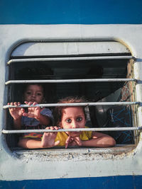 Portrait of boy in car window