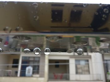 Low angle view of electric lamp on building