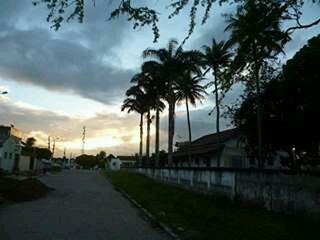 View of footpath against cloudy sky