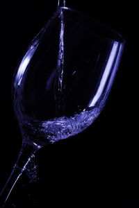 Close-up of water splashing against black background