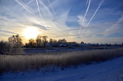 Scenic view of lake against sky during winter