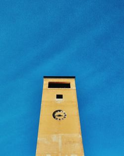 Low angle view of building against blue sky