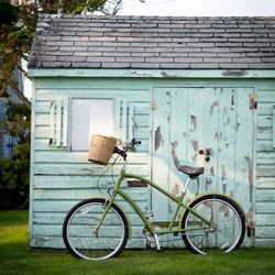 Bicycle parked against building