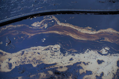 High angle view of snow covered mountain against sky