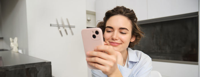 Young woman using mobile phone