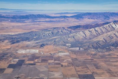 Aerial view of landscape with mountain range in background