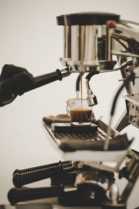 Close-up of hand holding coffee cup