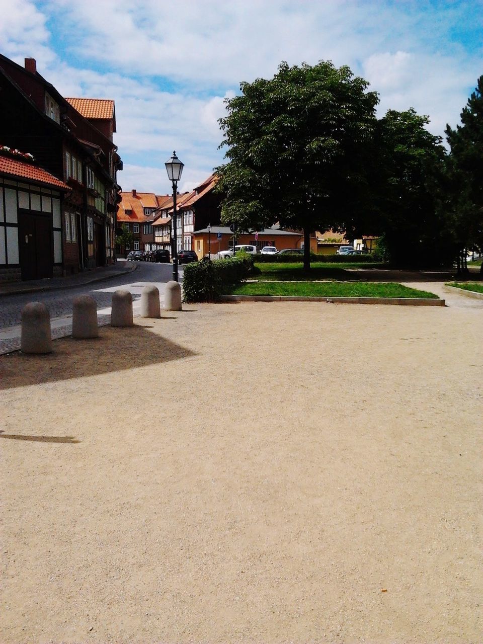 FOOTPATH BY BUILDINGS AGAINST SKY