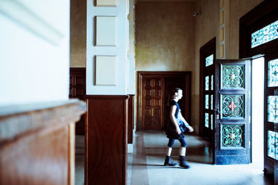 Full length of woman walking in corridor