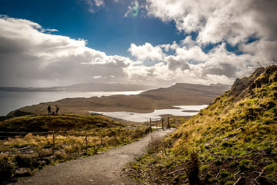 Pathway leading to calm lake