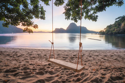 Scenic view of beach against sky during sunset